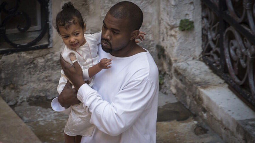Singer Kanye West with his daughter North as they leave the Saint James Armenian Church in Jerusalem’s Armenian Quarter in April 2015. Credit: Hadas Parush/Flash90.