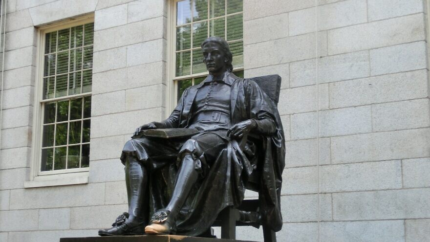 A statue of John Harvard at Harvard University. Credit: Pixabay.