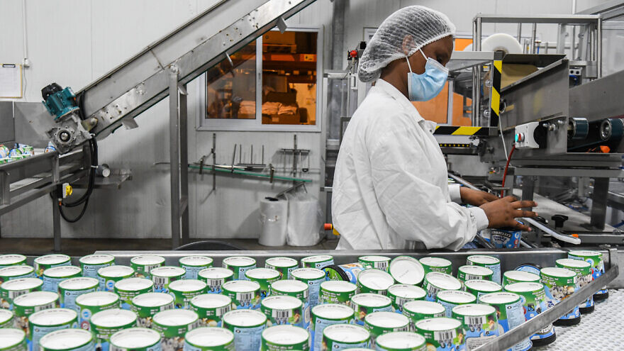 Workers at the Ben and Jerry's factory near Kiryat Malachi, on July 21, 2021. Photo by Flash90.