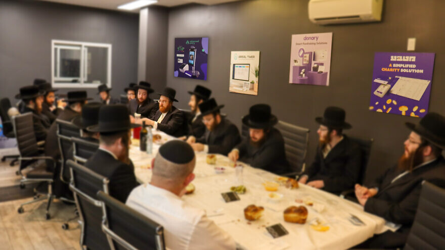 C2P Group meets for a Seudes Rosh Chodesh, a customary meal to welcome the new month. Courtesy C2P Group.