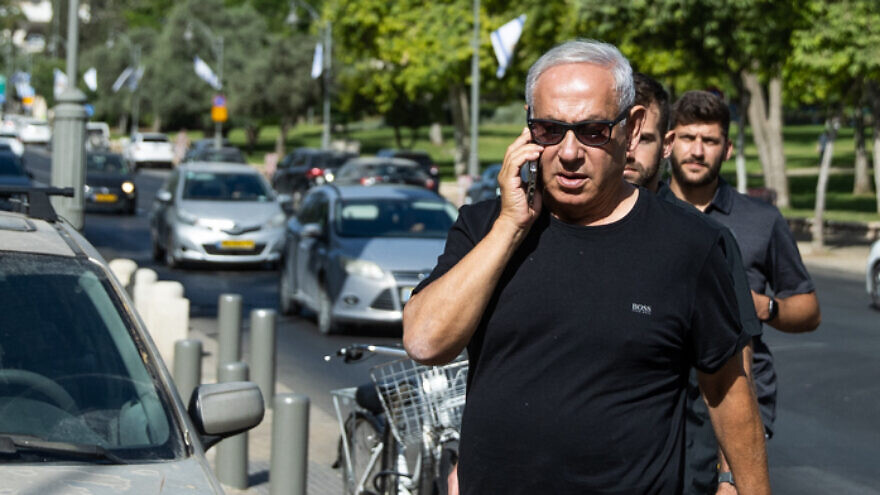Israeli opposition leader and former prime minister Benjamin Netanyahu takes a morning walk in central Jerusalem, June 1, 2022. Photo by Yonatan Sindel/Flash90.