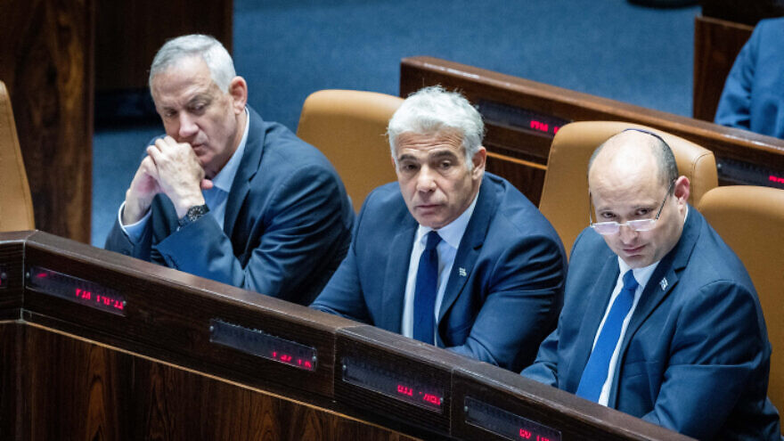 Israeli Prime Minister Naftali Bennett, Foreign Minister Yair Lapid Defense Minister Benny Gantz attend a vote on the "settler law" bill at the Knesset, June 6, 2022. Photo by Yonatan Sindel/Flash90.