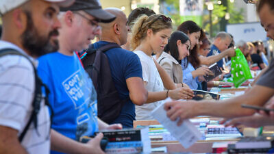 Israelis attend the annual Hebrew Book Week in Tel Aviv on June 15, 2022. Photo by Avshalom Sassoni/Flash90.