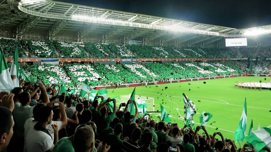 Fans at a Maccabi Haifa FC game in Israel. Credit: Wikimedia Commons.