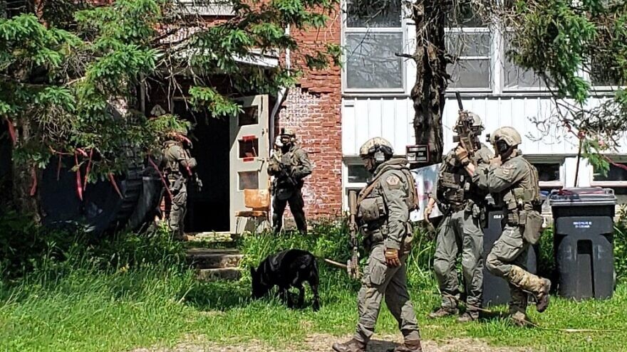 More than 60 Royal Canadian Mounted Police officers conducted raids at the homes of suspected members of the neo-Nazi group Atomwaffen Division on June 16, 2022. Source: Twitter/Royal Canadian Mounted Police.