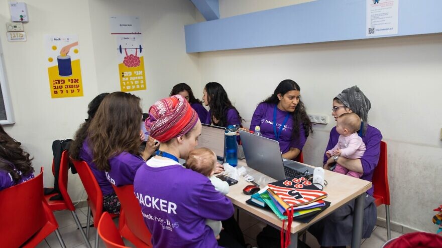 Women working at the JCT hackathon. Photo credit: Michael Erenburg