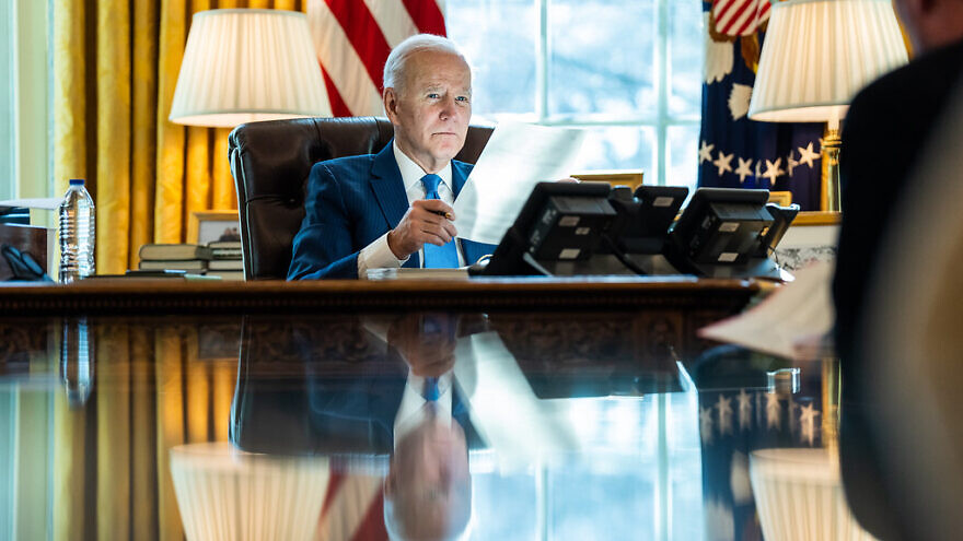 U.S. President Joe Biden talks on the phone with King Salman of Saudi Arabia on Feb. 9, 2022, in the Oval Office of the White House. Credit: Adam Schultz/White House.