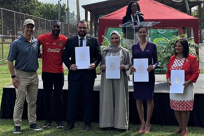 From left: World Games Birmingham Organizing Committee CEO Nick Sellars, Birmingham Mayor Randall Woodfin, Israel Deputy Consul General Alex Gandler, United Arab Emirates National Olympic Committee Acting General Secretary Azza Sulaiman, Moroccan Political Counselor Fatima Zahra Aboulfaraj and Bahrain Trade Representative Rose Sager receive proclamations at the dedication of the Abraham Accords tree site in Birmingham. Photo by Larry Brook.