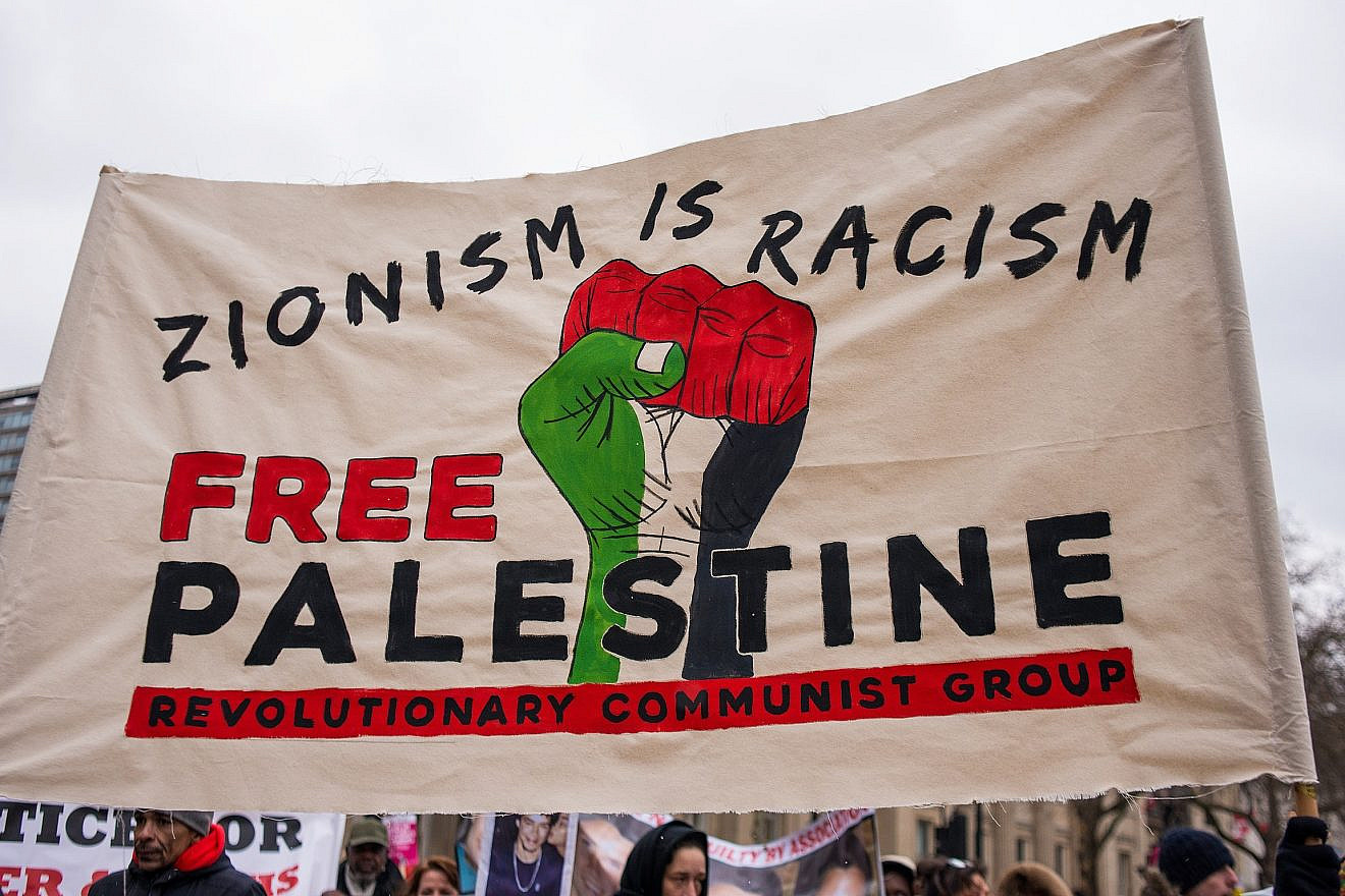 One of the larger banners and posters seen at the March Against Racism national demonstration in London, in protest of the dramatic rise in race-related attacks, March 17, 2018. Credit: John Gomez/Shutterstock.