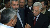 Palestinian Authority leader Mahmoud Abbas (R) and Hamas Prime Minister Ismail Haniyeh (C) visit Odwan hospital in the northern Gaza Strip, Nov. 8, 2006. Photo by Ahmad Khateib/ Flash90.