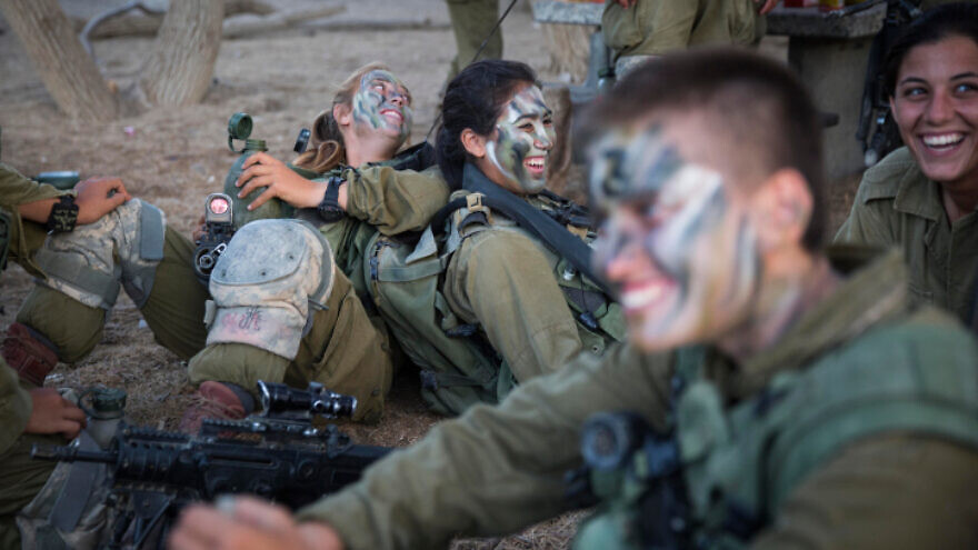 Soldiers of the IDF Caracal Battalion prepare before a 16 kilometer journey overnight to complete their training course, in Azoz village, southern Israel, near the border with Egypt, September 3, 2014. Photo by Hadas Parush/Flash90.