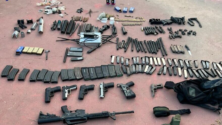 A cache of weapons and ammunition captured during an Israeli raid on a terrorist hideout in Nablus, on July 24, 2022. Credit: Israel Police.