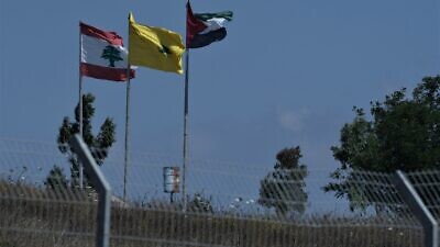 Hezbollah flags on the border between Israel and Lebanon, northern Israel, July 3, 2022. Photo by Ayal Margolin/Flash90.