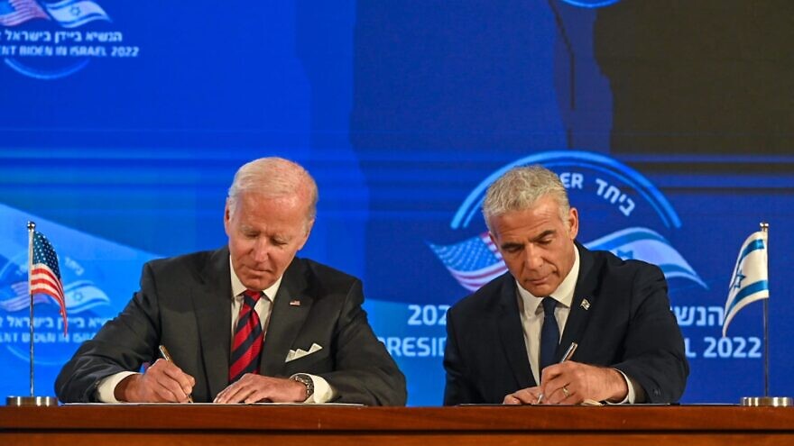 U.S. President Joe Biden and Israeli Prime Minister Yair Lapid sign the “Jerusalem U.S.-Israel Strategic Partnership Joint Declaration,” which states that America will “use all elements of its national power" to prevent Iran from acquiring nuclear weapons. Credit: Kobi Gideon/GPO