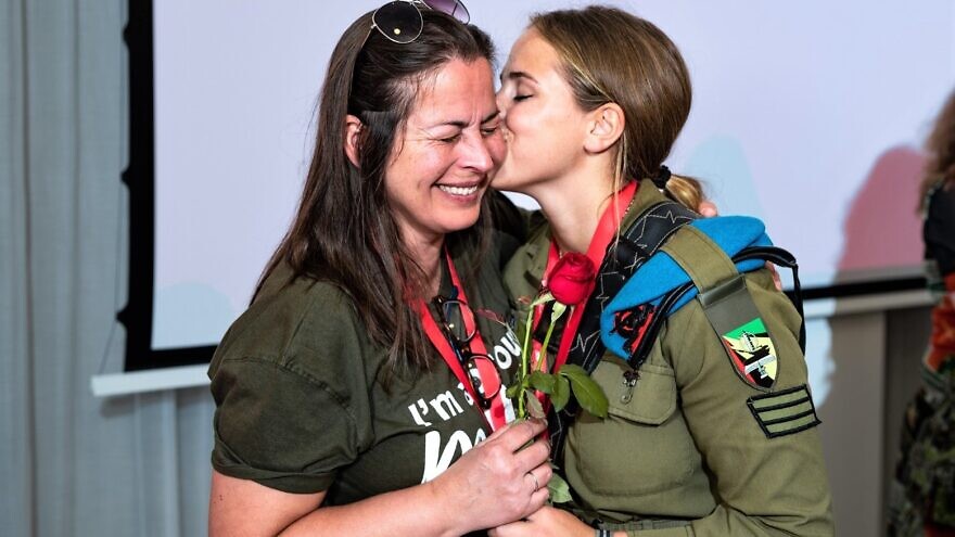 The mother of a lone soldier reunites with her daughter, who currently serves in the Israel Defense Forces, during a trip with the global movement Momentum at an event hosted by Nefesh B'Nefesh in Jerusalem on July 8, 2022. Photo by Aviram Valdman.
