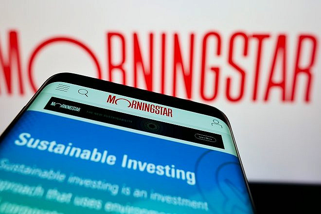 Smartphone with webpage of American financial-services company Morningstar Inc. on screen in front of the logo, Feb. 6, 2022. Credit: T. Schneider/Shutterstock.