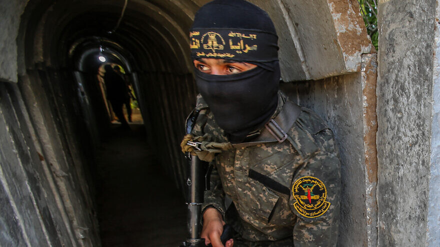 A member of the Al-Quds Brigades, the "military wing" of Palestinian Islamic Jihad, inside an attack tunnel in Beit Hanun in the northern Gaza Strip, May 18, 2022. Credit: Attia Muhammed/Flash90.