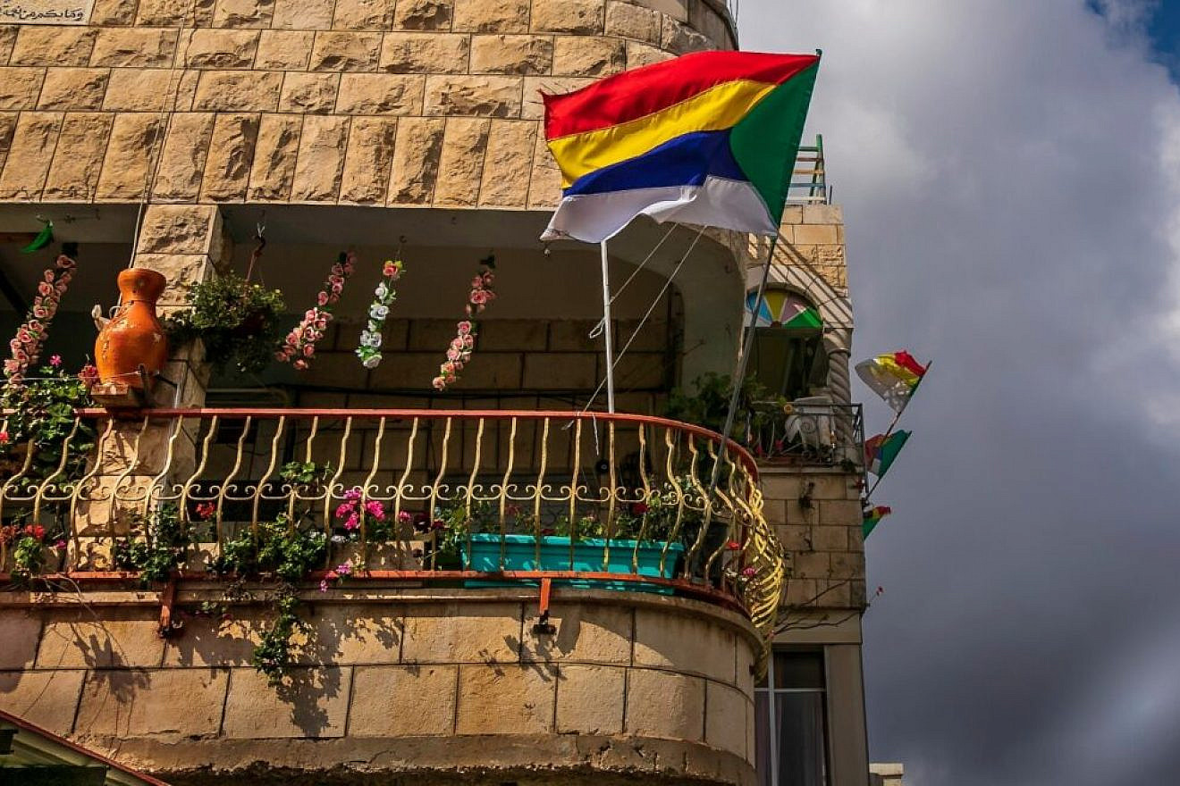 A Druze flag flies in Daliat el-Carmel. Photo by Harvey Sapir Photography via Pikiwiki Israel.