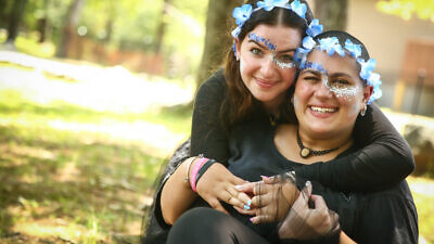 Tevel Argental (right) and her counselor at Camp Simcha. Credit: Chai Lifeline.