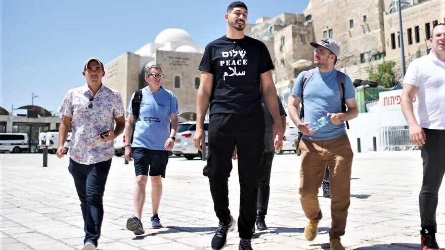 Enes Kanter Freedom walks to the Western Wall in Israel, there to help train kids at a youth basketball camp in Israel, August 2022. Photo by Josh Hasten. Credit: Bnai Zion.