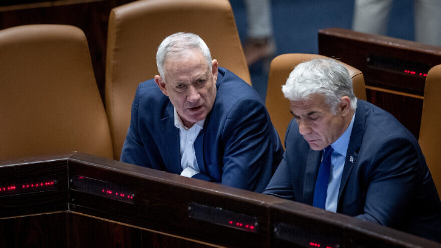 Foreign Minister Yair Lapid and Defense Minister Benny Gantz attend a plenum session at the Knesset in Jerusalem on June 20, 2022. Photo by Yonatan Sindel/Flash90.