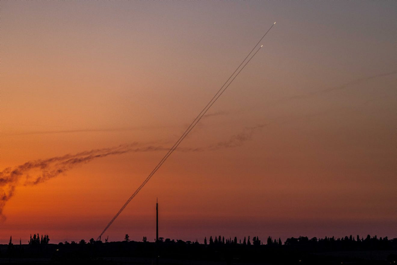 Terrorists fire a rocket from the Gaza Strip, as seen from Western Negev, Aug. 7, 2022. Photo by Yonatan Sindel/Flash90.