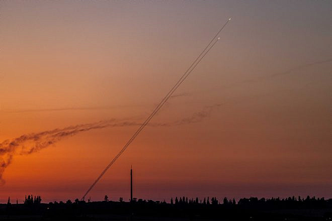 Terrorists fire a rocket from the Gaza Strip, as seen from Western Negev, Aug. 7, 2022. Photo by Yonatan Sindel/Flash90.
