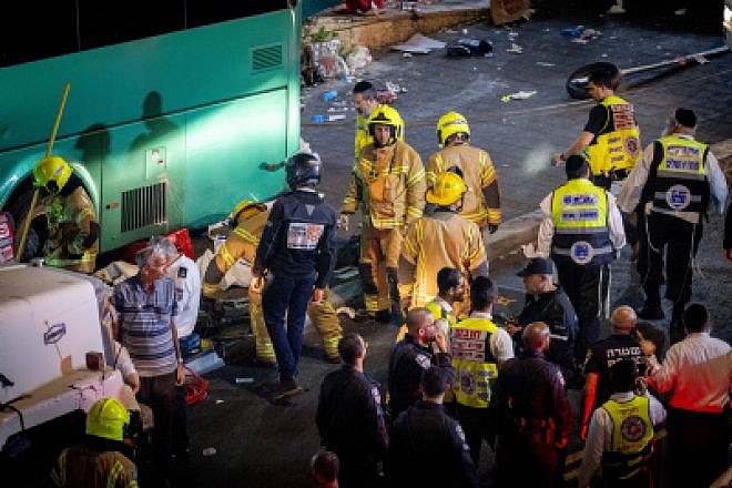 Police and rescue personnel at the scene of where a bus lost control and plowed into a bus station in central Jerusalem, killing three people, Aug. 11, 2022. Photo by Yonatan Sindel/Flash90.