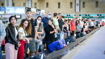 Travelers at Ben-Gurion International Airport near Tel Aviv on Aug. 21, 2022. Photo by Noam Revkin Fenton/Flash90.