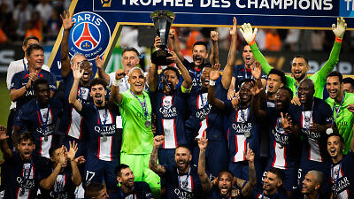 PSG players celebrate with the trophy their win in the French Super Cup match against Nantes at Bloomfield Stadium in Tel Aviv on July 31, 2022. Photo by Oren Ben Hakoon/Flash90.