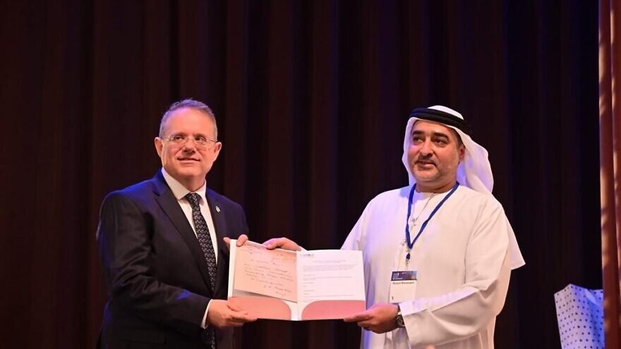 Ahmed Obaid Al Mansoori, the founder of the Crossroads of Civilization Museum in Dubai, presents World Zionist Organization chairman Yaakov Hagoel with a letter written and signed by Zionist founder Theodor Herzl, at an event in Basel, Switzerland to mark the 125th anniversary of the First Zionist Congress. Credit: World Zionist Organization.