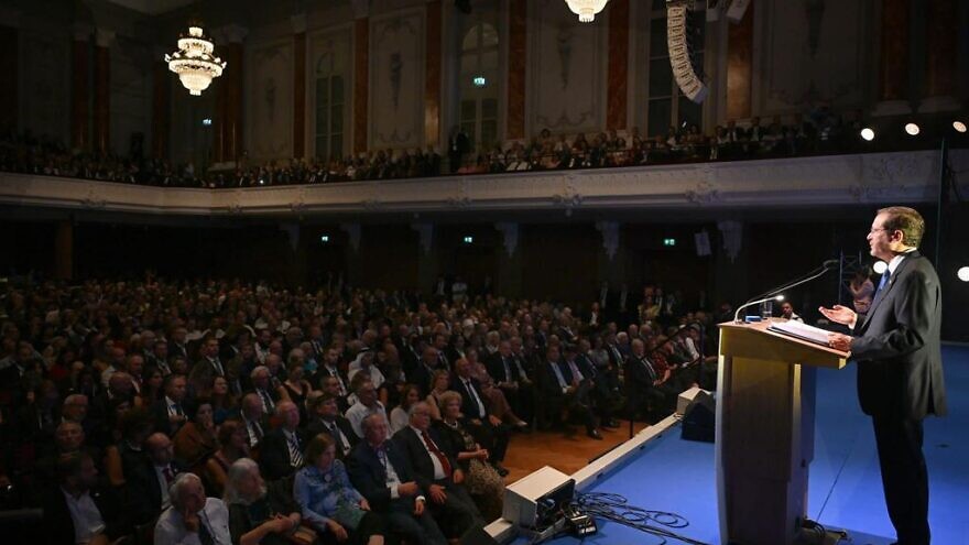 Israeli President Isaac Herzog delivers a speech at the Stadtcasino Basel concert hall in Basel, Switzerland, on Aug. 29, 2022, to mark the 125th anniversary of the First Zionist Congress. Credit: Haim Zach/GPO.