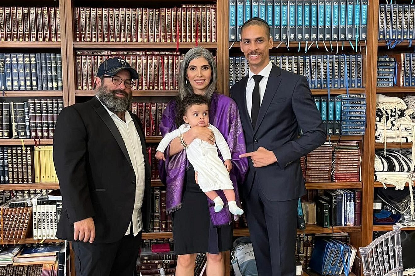 Rabbi Mayshe Schwartz with a family he counseled when their child was hospitalized. Source: courtesy.