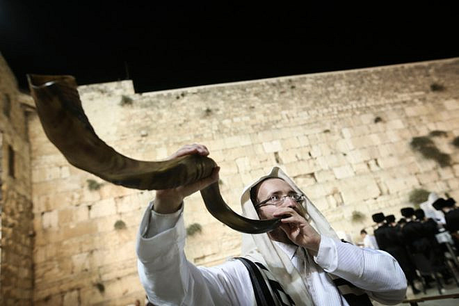 A shofar is blown at the Western Wall in Jerusalem's Old City, at the end of Yom Kippur, Oct. 12, 2016. Photo by Flash90.