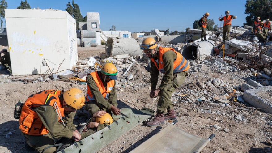 Members of the Knesset Honor Guard, IDF Home Front Command, firefighters, and Magen David Adom participate in an emergency drill simulating an earthquake near Ashkelon, on Dec. 19, 2019. Photo by Yaniv Nadav/Flash90.
