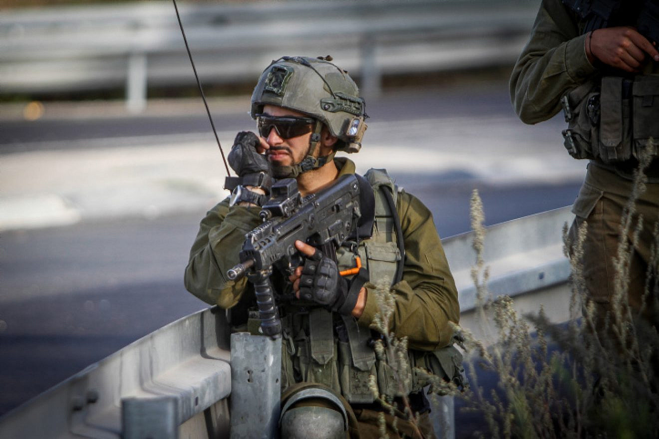 An Israeli soldier near the scene of a suspected vehicular assault near Yitzhar, Sept. 24, 2022. Photo by Nasser Ishtayeh/Flash90.