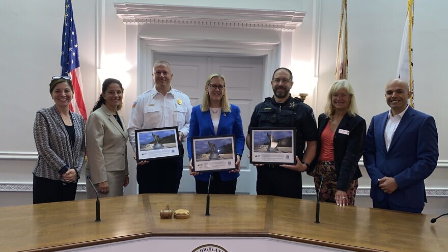 From let: Michelle Miller; Ghita Neukirch, Highland Park City Manager; Joe Schrage, Highland Park Fire Chief; Nancy Rotering, Highland Park Mayor; Bill Bonaguidi, Deputy Police Chief; Annette Lidawer, Highland Park City Council; and Yinam Cohen, Consulate General of Israel Midwest.