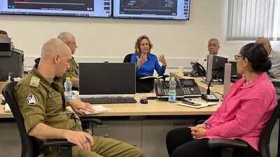 Israeli officials conduct a COVID-19 “war game” exercise at the headquarters of the military’s Alon coronavirus task force in Ramle. Credit: Maayan Hoffman.