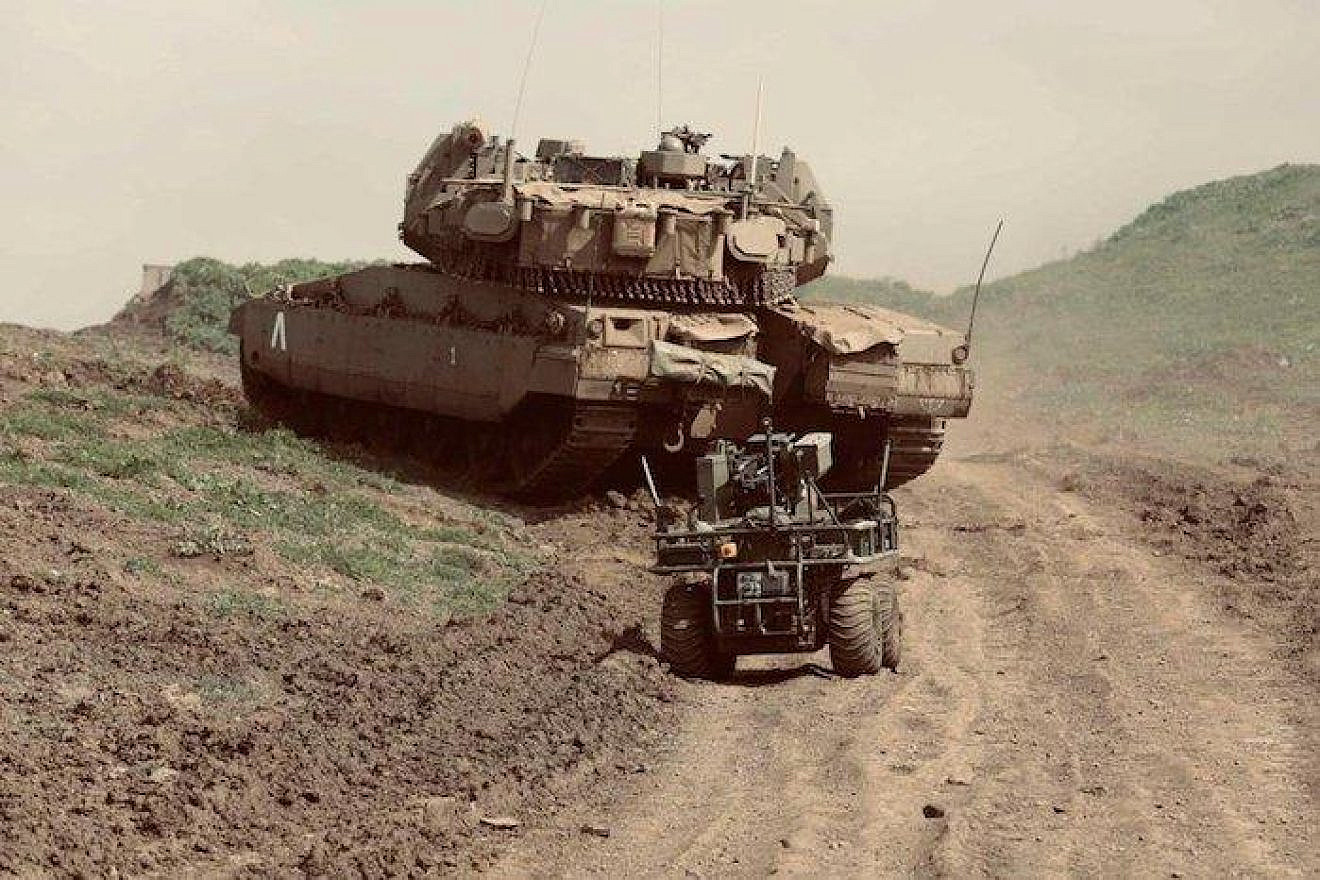 A robotic vehicle and a tank maneuver as part of the IDF's International Operational Innovation Conference at the Tze’elim Base in the Negev last week. Credit: IDF Spokesperson's Unit.