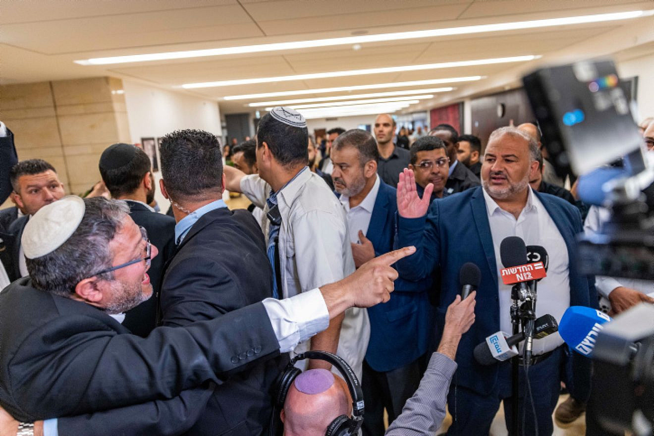 MK Itamar Ben-Gvir (left) reacts to a press conference held by United Arab List (Ra'am) leader MK Mansour Abbas at the Knesset in Jerusalem, May 11, 2022. Photo by Olivier Fitoussi/Flash90.
