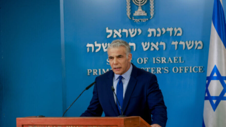 Israeli prime minister Yair Lapid, Minister of Defense Benny Gantz and Israeli Minister of Energy Karin Elharar hold a press conference on the maritime border deal with Lebanon, at the Prime Minister's office in Jerusalem, on October 12, 2022. Photo by Olivier Fitoussi/Flash90