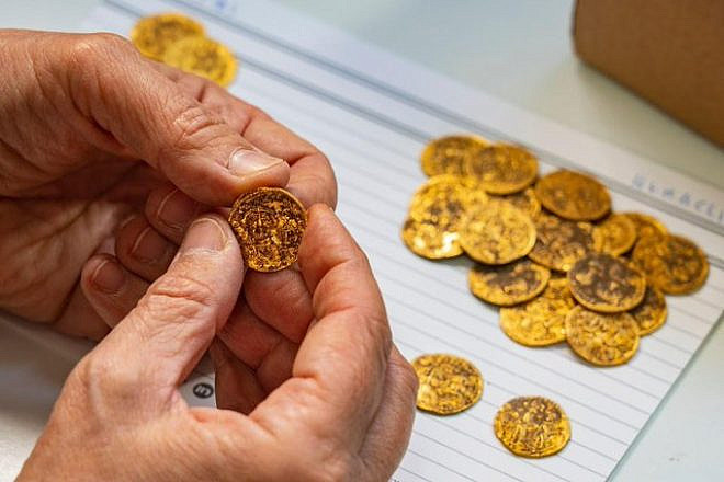 1,400-year-old gold coins found concealed in a wall at the Banias archeological site. Credit: Israel Antiquities Authority.