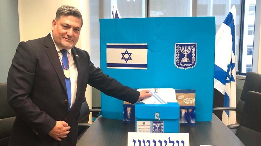 Israeli Ambassador to New Zealand Ran Yaakoby casts the first early ballot in the Jewish state's Nov. 1 national election, Oct. 20, 2022. Credit: Ran Yaakoby Twitter.