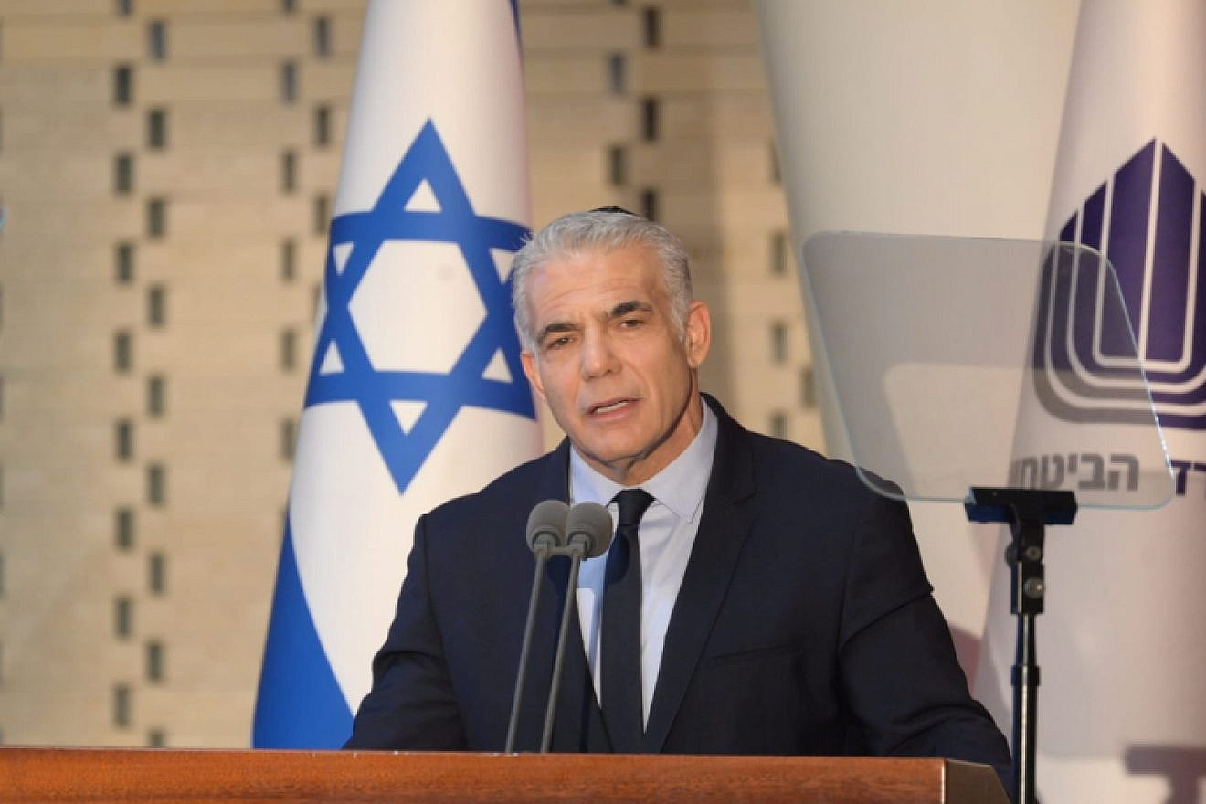 Interim Israeli Prime Minister Yair Lapid delivers a speech at a ceremony at Mount Herzl in Jerusalem for Israel Defense Forces soldiers who fell in the Yom Kippur War, Oct. 6, 2022. Credit: Prime Minister's Office.