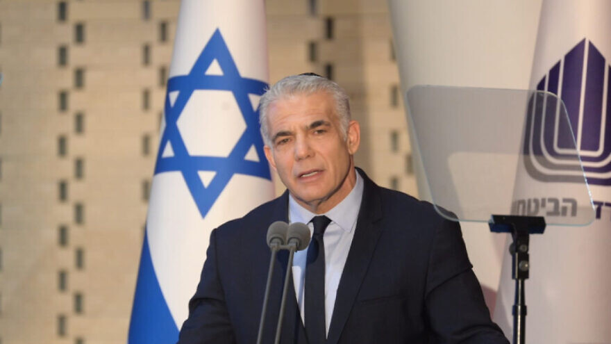 Interim Israeli Prime Minister Yair Lapid delivers a speech at a ceremony for the IDF soldiers who fell in the Yom Kippur War, Mount Herzl, Jerusalem, Oct. 6, 2022. Credit: Prime Minister's Office.