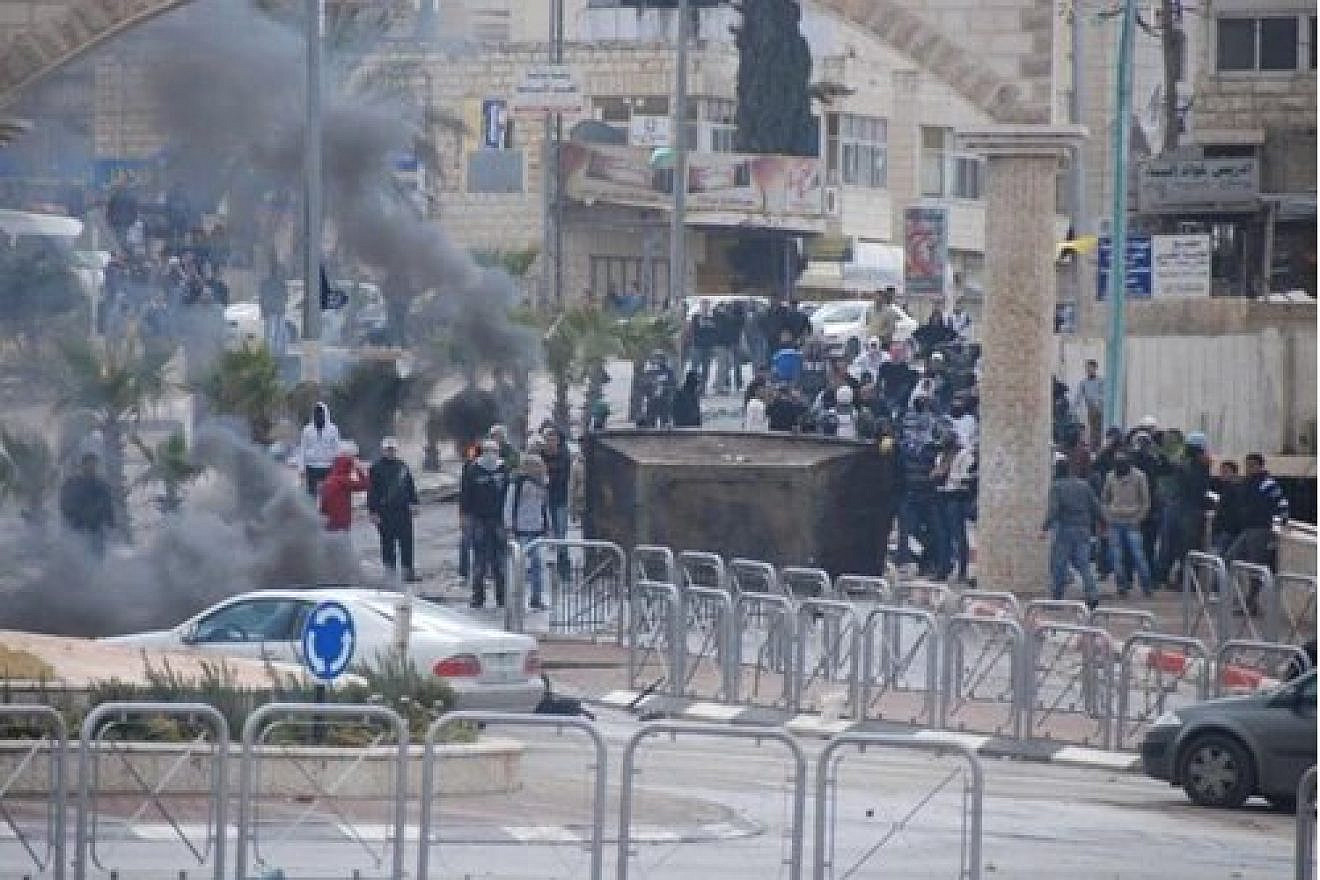 Palestinians riot in Al-Ram, northeast of Jerusalem, Oct. 12, 2022. Credit: IDF.