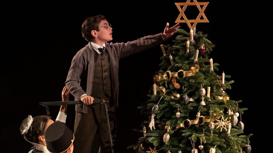 A scene from the play "Leopoldstadt," which opens in 1899 at a family Christmas party, where one of the children places a large Star of David atop the tree. Credit: "Leopoldstadt."
