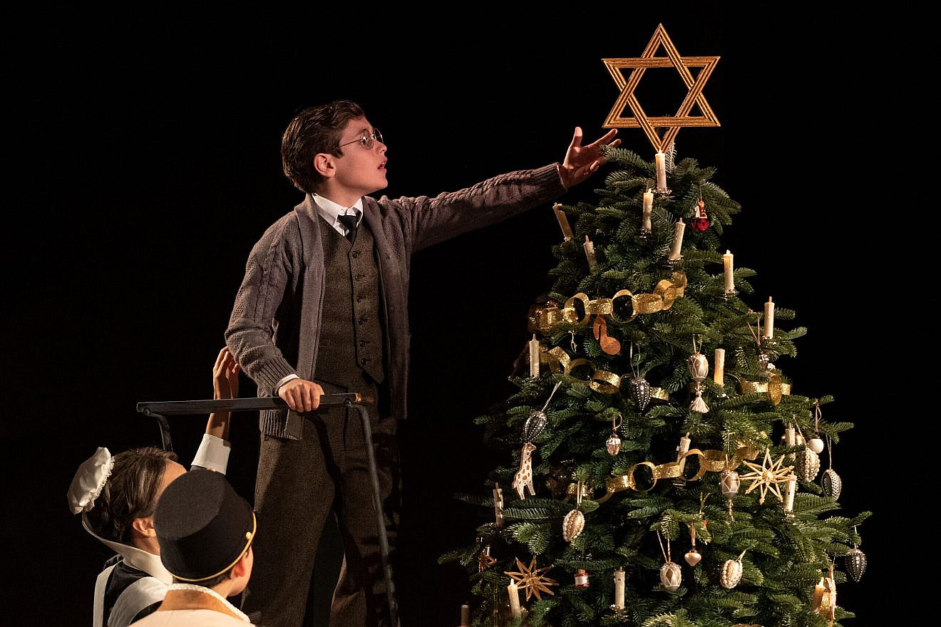 A scene from the play "Leopoldstadt," which opens in 1899 at a family Christmas party, where one of the children places a large Star of David atop the tree. Credit: "Leopoldstadt."