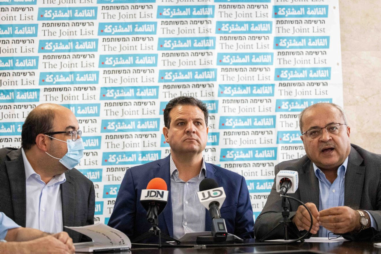 Hadash-Ta'al party leaders: Aymen Odeh (center) and Ahmad Tibi (right). (Credit: Yonatan Sindel/Flash90)