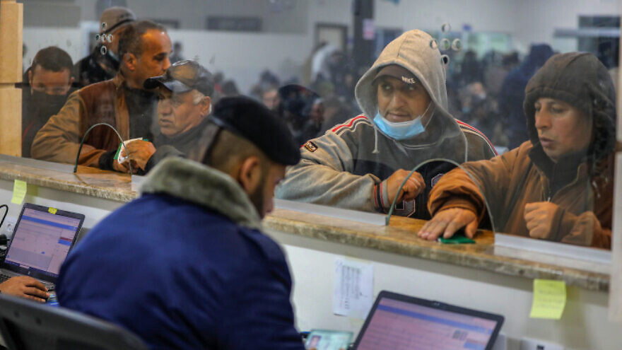 Palestinian workers wait at the Erez crossing in Beit Hanun, in the northern Gaza Strip, to enter Israel for work, on March 13, 2022. Photo by Attia Muhammed/Flash90.